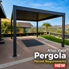 Modern black aluminum louvered pergola installed in an Aliso Viejo backyard with hillside greenbelt, drought-tolerant landscaping, and Spanish-tile suburban home at golden hour